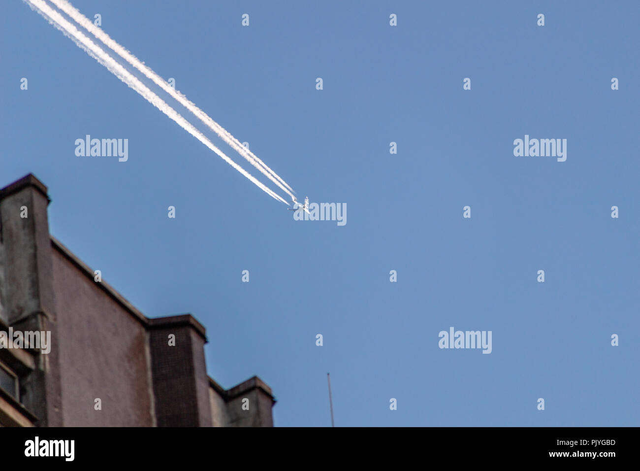 Aircraft on blue sky background Stock Photo - Alamy