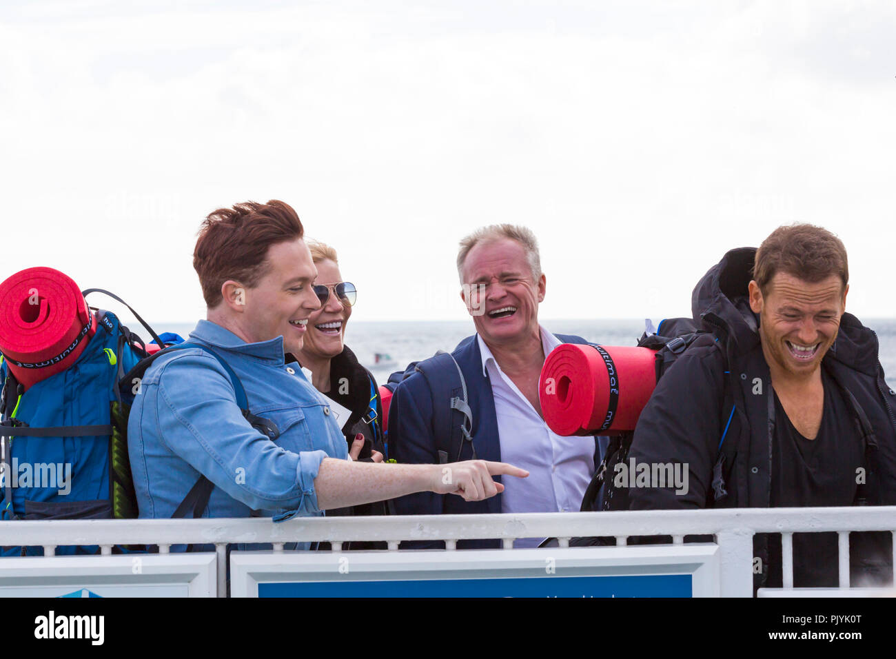 Poole, UK. 09th Sep, 2018. Celebrities  Bobby Davro, Stephen Bailey,  Joe Swash and Michelle Collins take the Bramble Bush Ferry chain ferry from Sandbanks across to Studland, carrying backpacks ready for ‘camping it up’ at Burnbake for a new TV series. Credit: Carolyn Jenkins/Alamy Live News Stock Photo