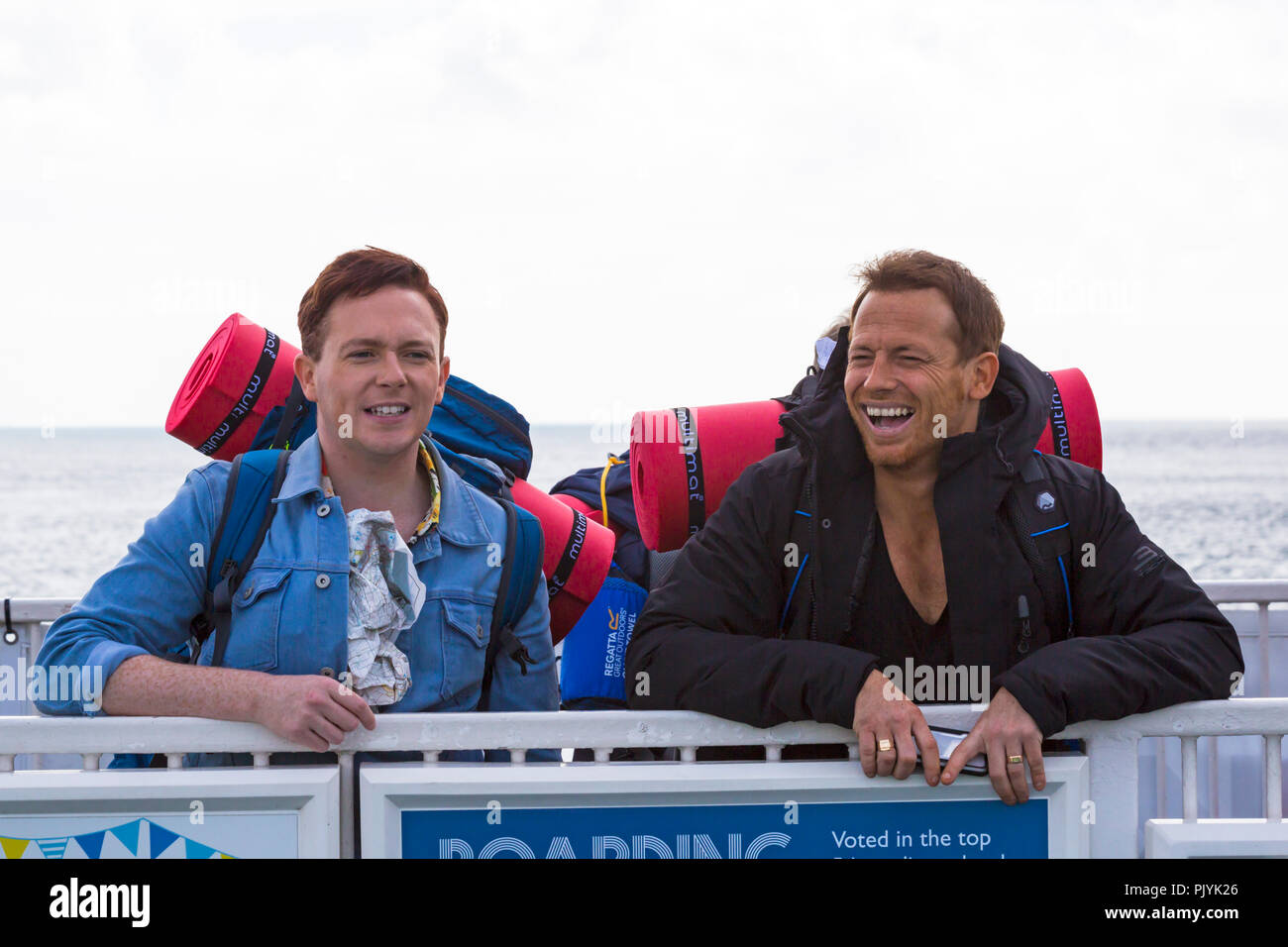 Poole, UK. 09th Sep, 2018. Celebrities  Joe Swash and Stephen Bailey take the Bramble Bush Ferry chain ferry from Sandbanks across to Studland, carrying backpacks and screwed up map ready for ‘camping it up’ at Burnbake for a new TV series. Credit: Carolyn Jenkins/Alamy Live News Stock Photo
