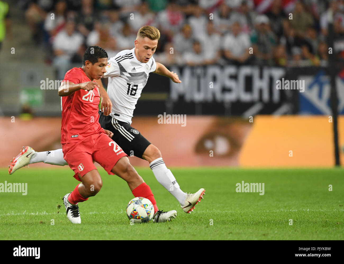 Sinsheim, Germany. 09th Sep, 2018. Soccer Friendly match: Germany vs Peru in the Wirsol Rhein-Neckar-Arena: Joshua Kimmich (R) from Germany tries to take the ball away from Edison Flores from Peru. Credit: Arne Dedert/dpa/Alamy Live News Stock Photo