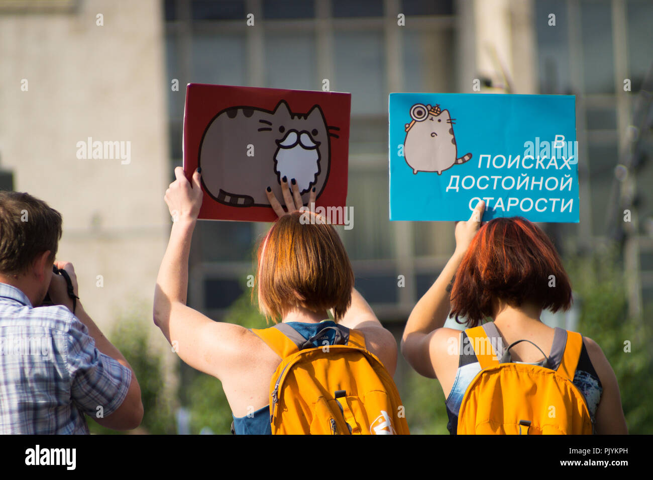 Moscow, Russia. 9th Sept 2018. Young women are holding a series of signs saying 'In Search of Dignified Retirement' during an anti-government rally in Moscow where Russian opposition activists gathered to express resentment about the upcoming pension refrom. Credit: Roman Chukanov/Alamy Live News Stock Photo