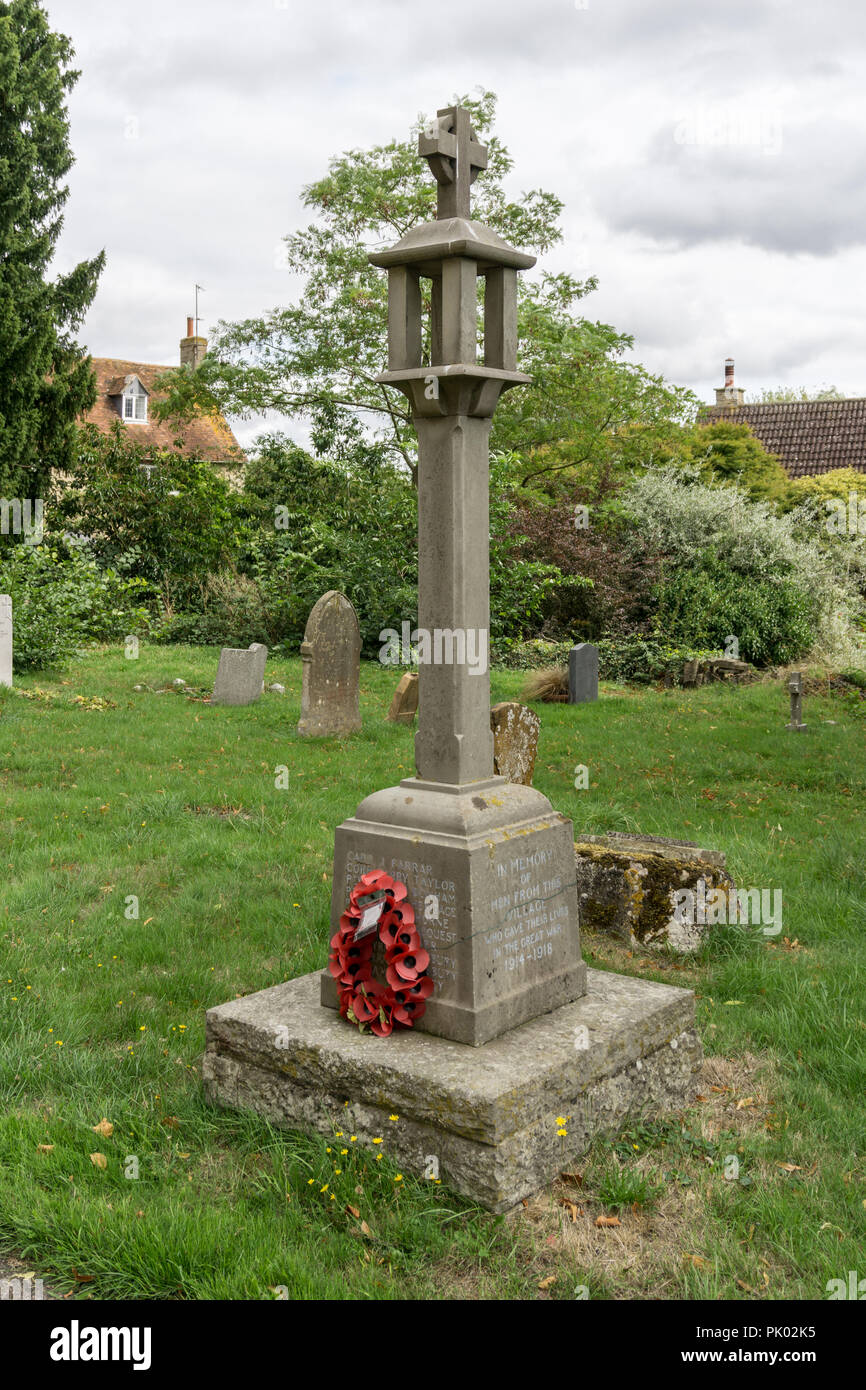 WW1 war memorial in the churchyard of the parish church of All Saints in the Bedfordshire village of Milton Ernest, UK Stock Photo