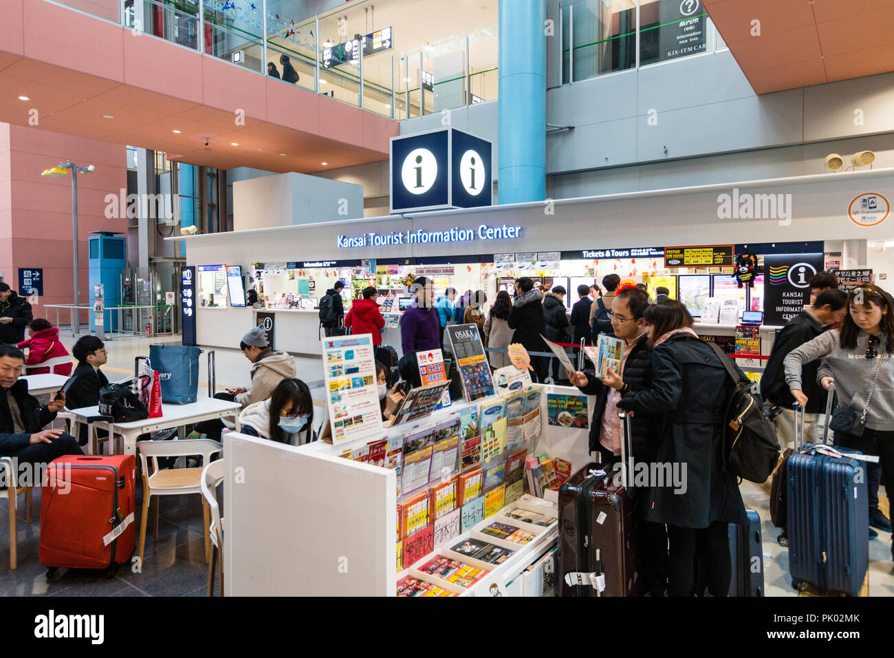 Japan Osaka Kansai International Airport Kix Interior Terminal One Ground Floor Tourist Information Desk With People Waiting Stock Photo Alamy