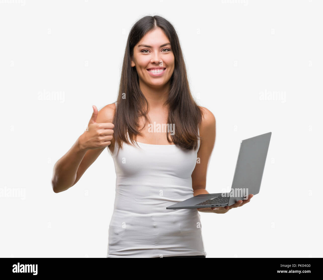 Young hispanic woman using computer laptop happy with big smile doing ...