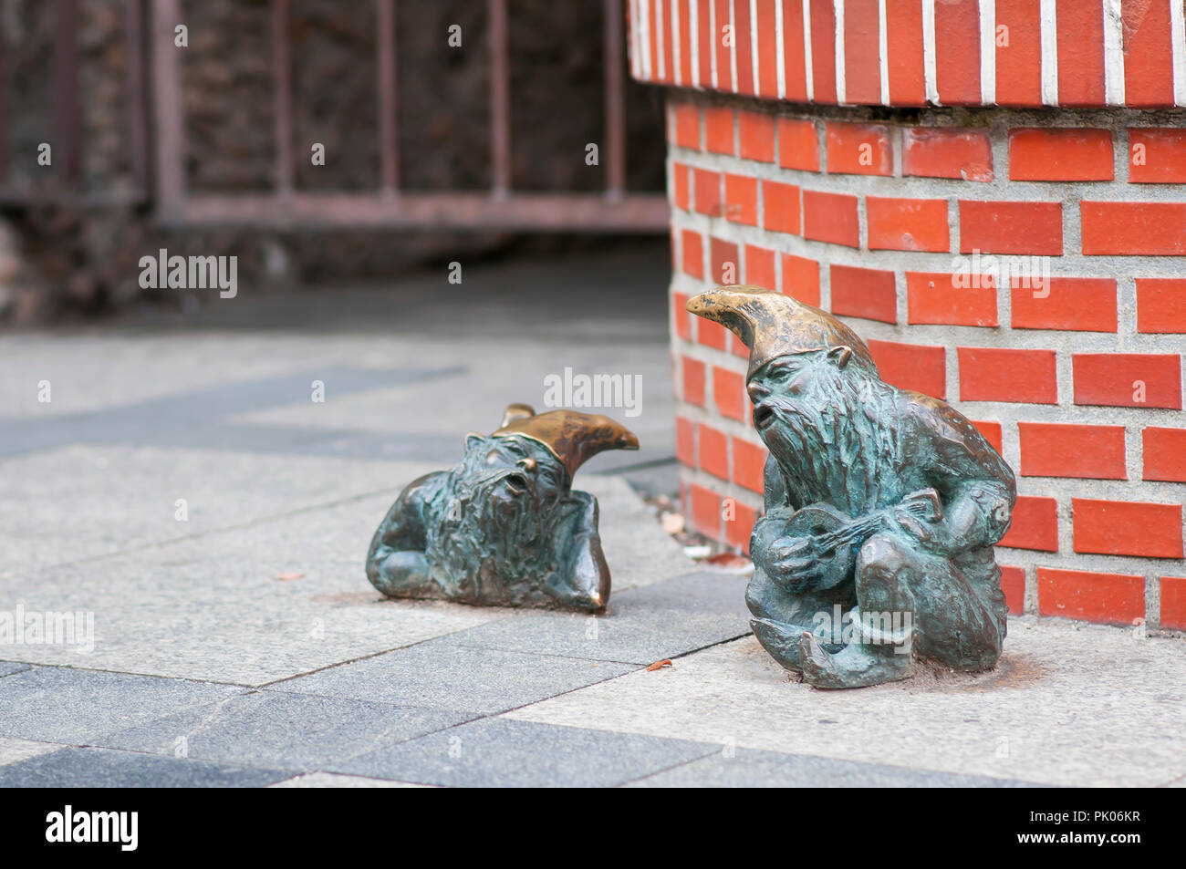 Small dwarf 'Grajek I Meloman' Gnome statue on the market square in Wroclaw Stock Photo