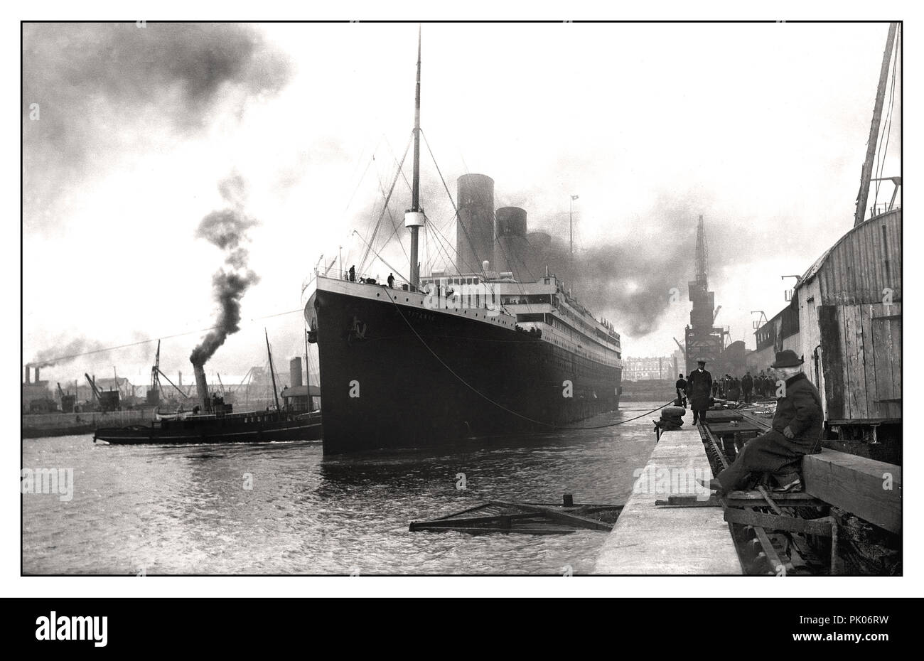 TITANIC 1912 RMS TITANIC leaving Harland & Wolff shipyards April 2nd 1912 Sombre still dawn image of Titanic casting off on her fateful maiden voyage Stock Photo
