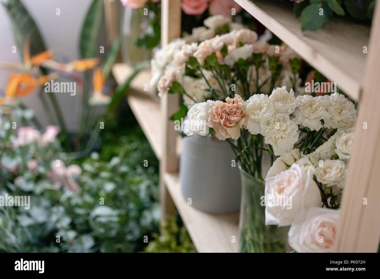 Flower shop concept. Different varieties fresh spring flowers in