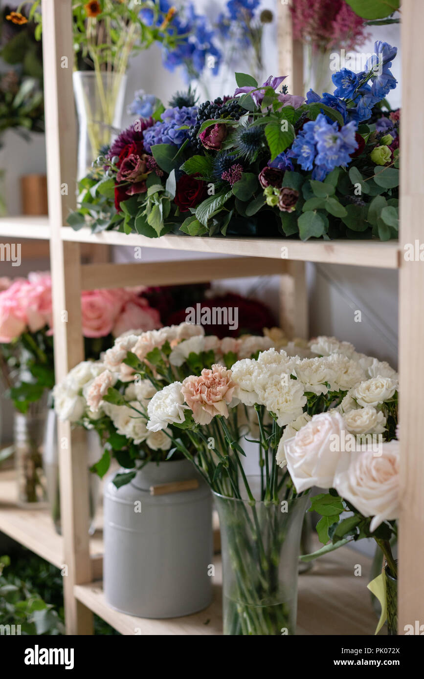 Flower shop concept. Different varieties fresh spring flowers in