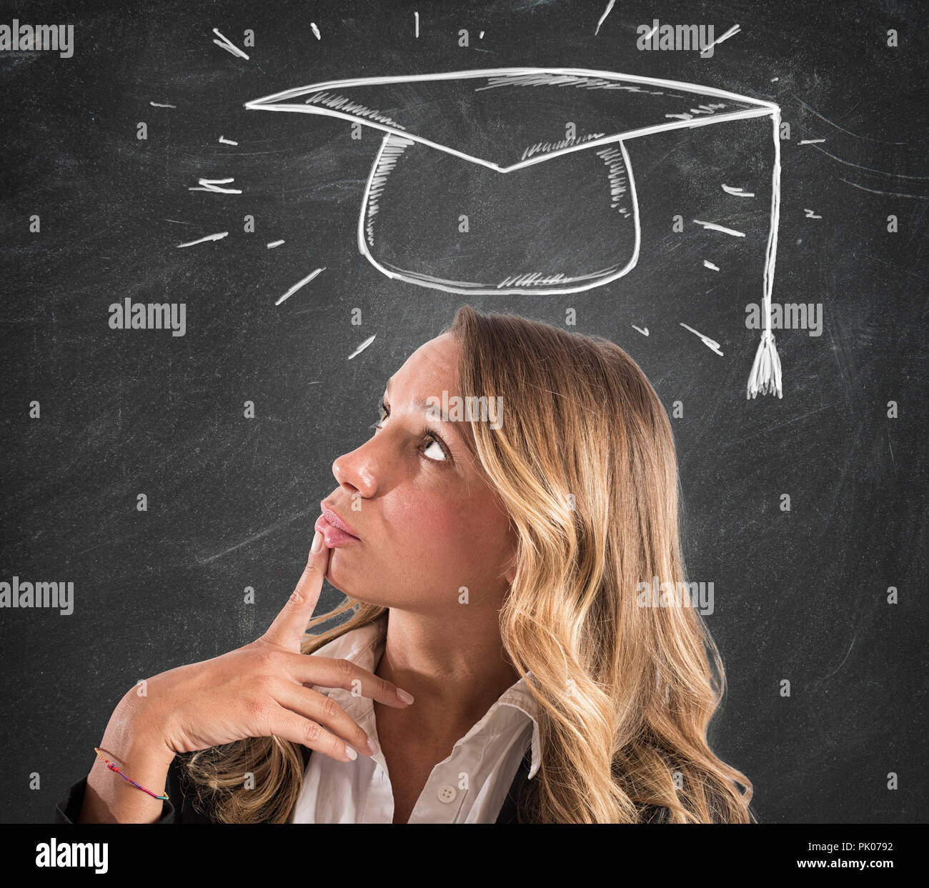 Blonde woman student thinks about her graduation Stock Photo