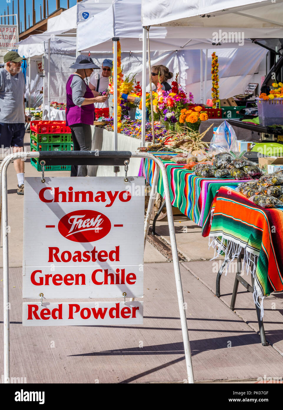 Chimayo red chile powder and roasted green chile for sale sign at the