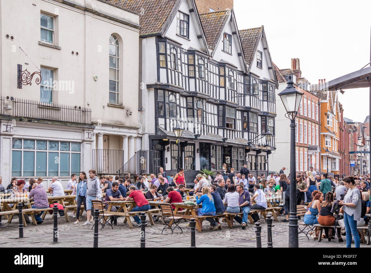 People relaxing at a pub in King Street in the city of Bristol, England, UK Stock Photo