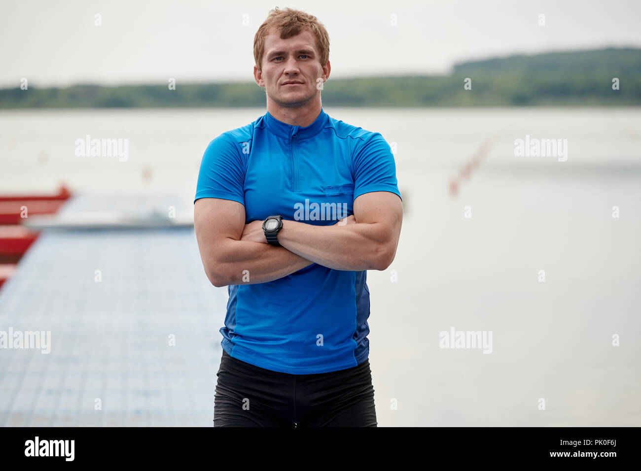 Sportsman standing outdoors Stock Photo Alamy