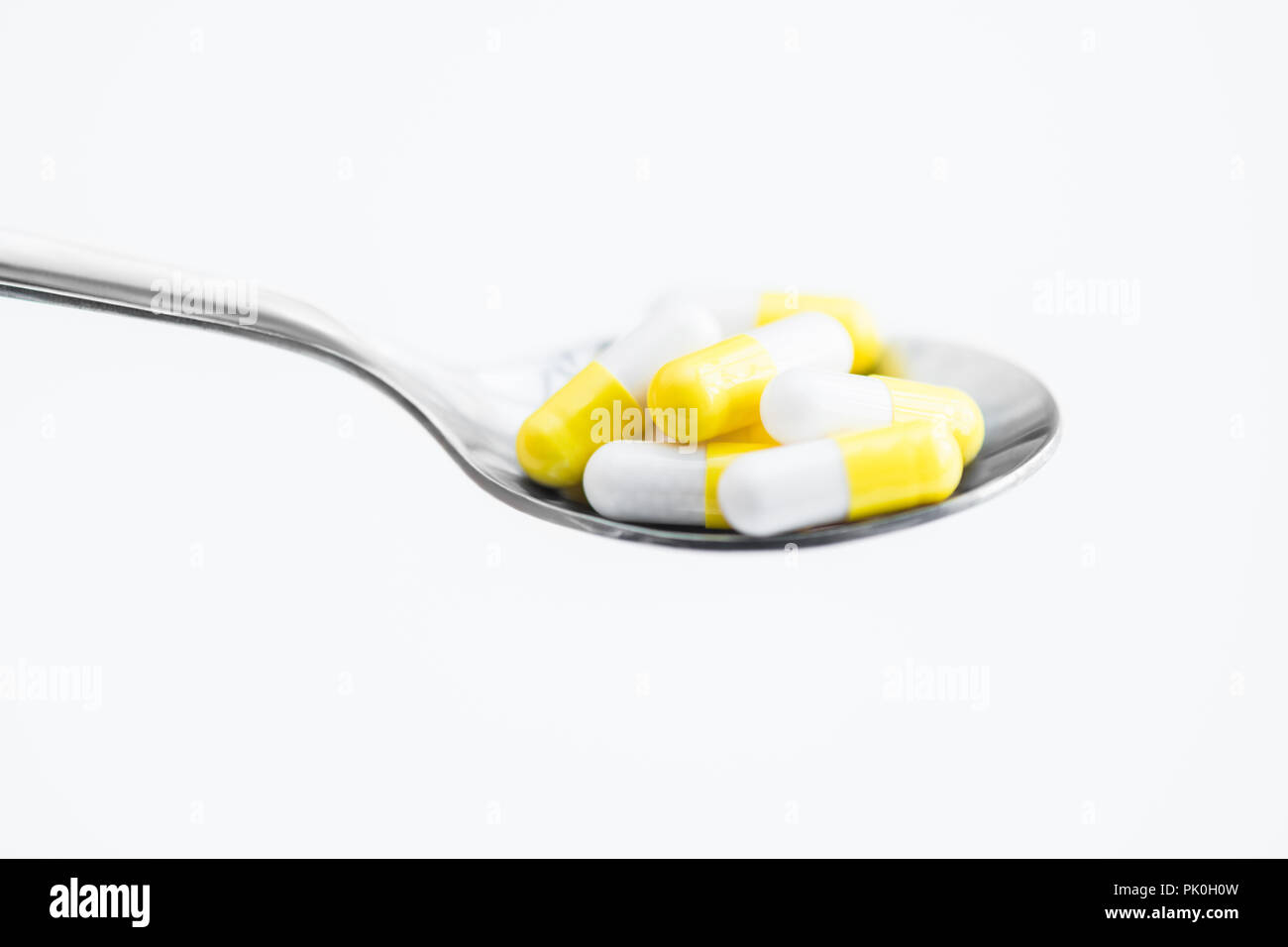 Spoonful of Pills Stock Photo