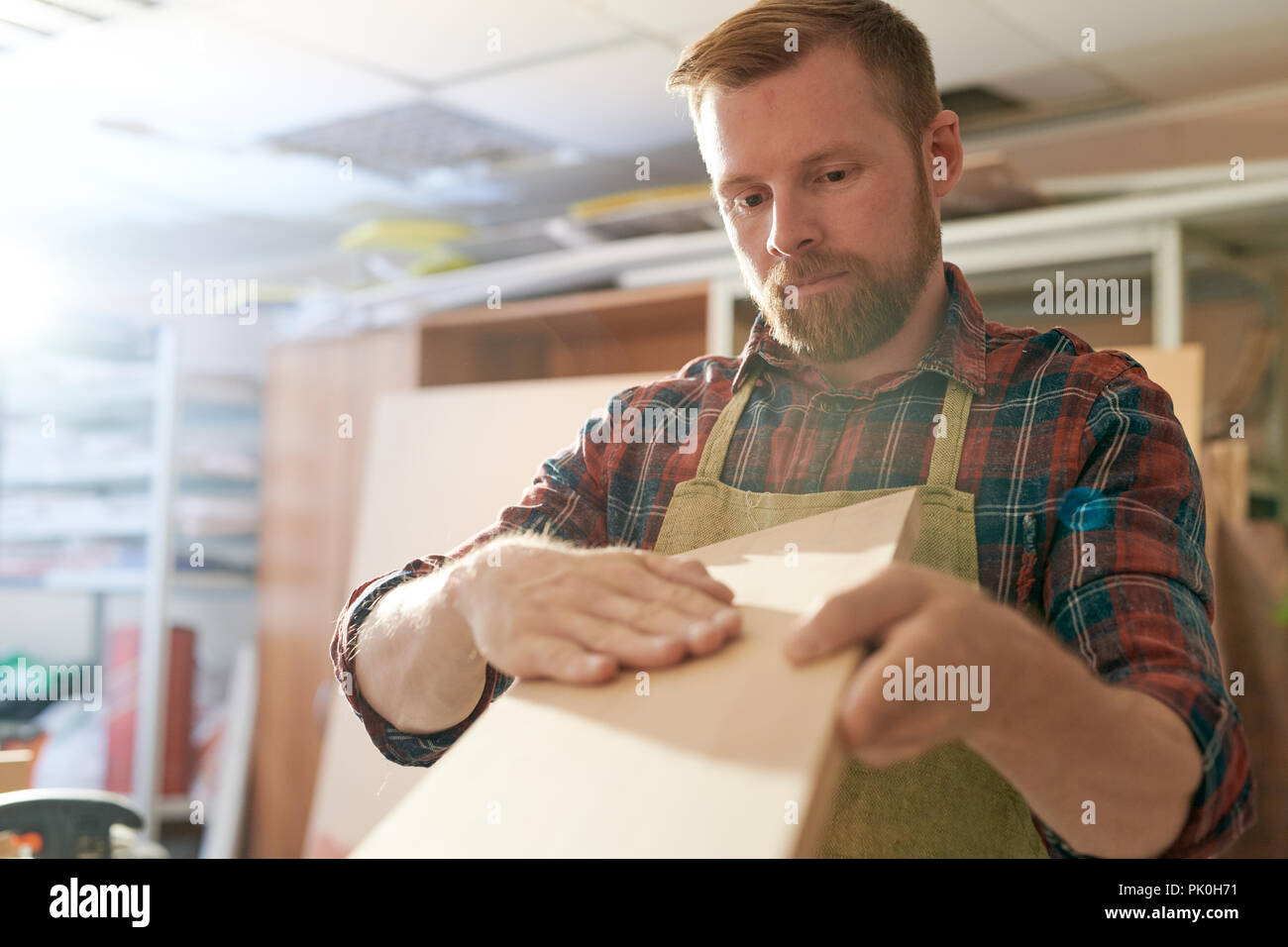 Carpenter working with wood Stock Photo