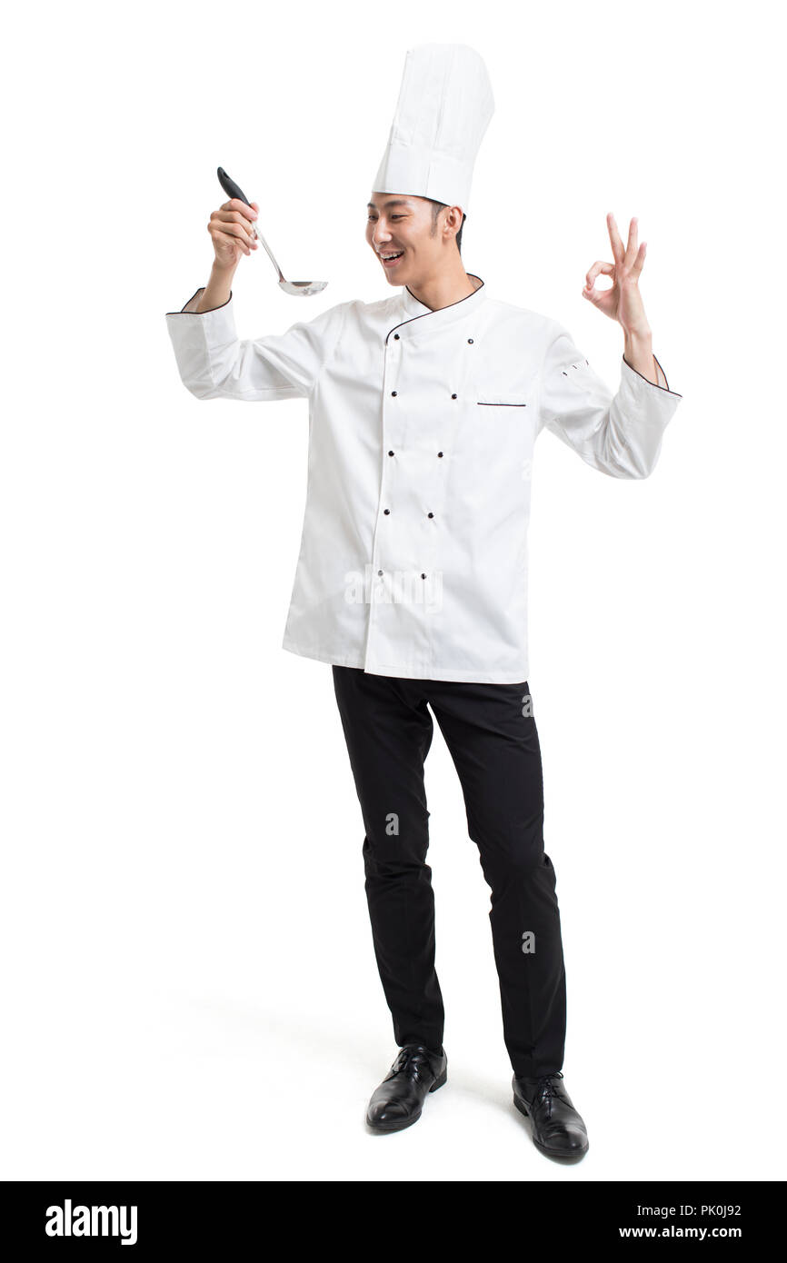 Cheerful chef holding a ladle Stock Photo