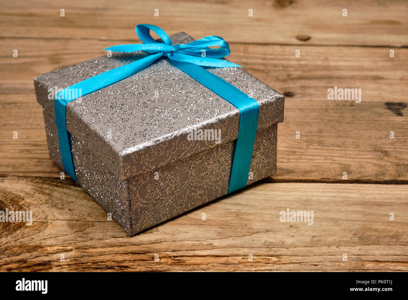 Gift box with blue ribbon Stock Photo Alamy