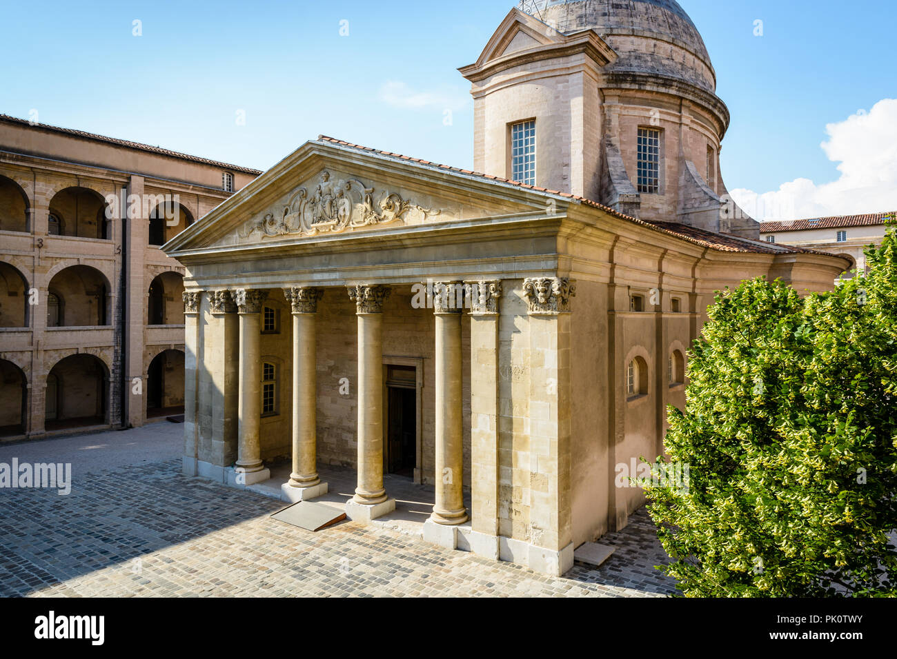 The chapel, its dome and classical style portico in the courtyard of La Vieille Charite in Marseille, France, and the arcaded galleries of the wings. Stock Photo