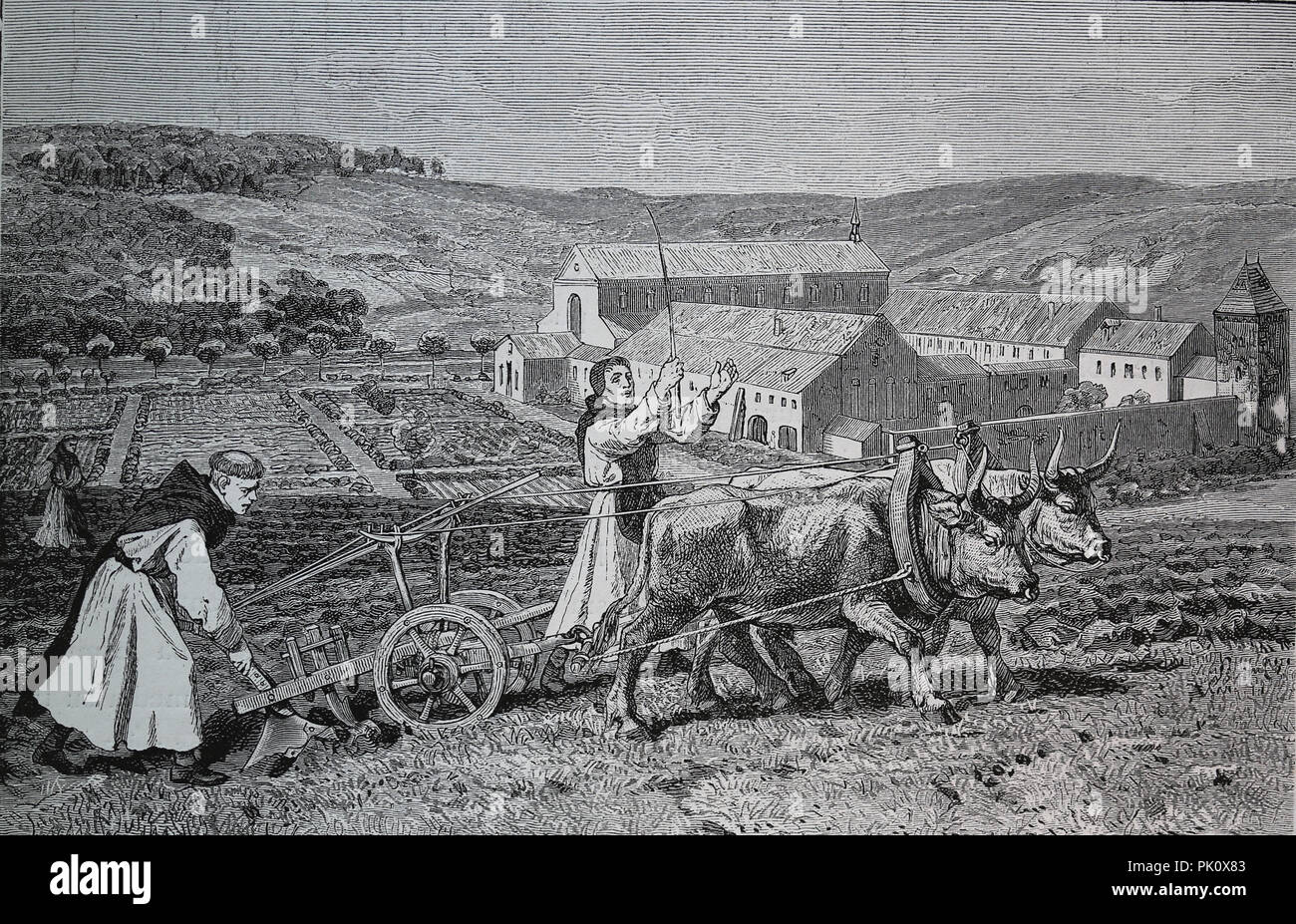 Middle Ages. German monks plowing the earth. Engraving of Germania, 1882. Stock Photo