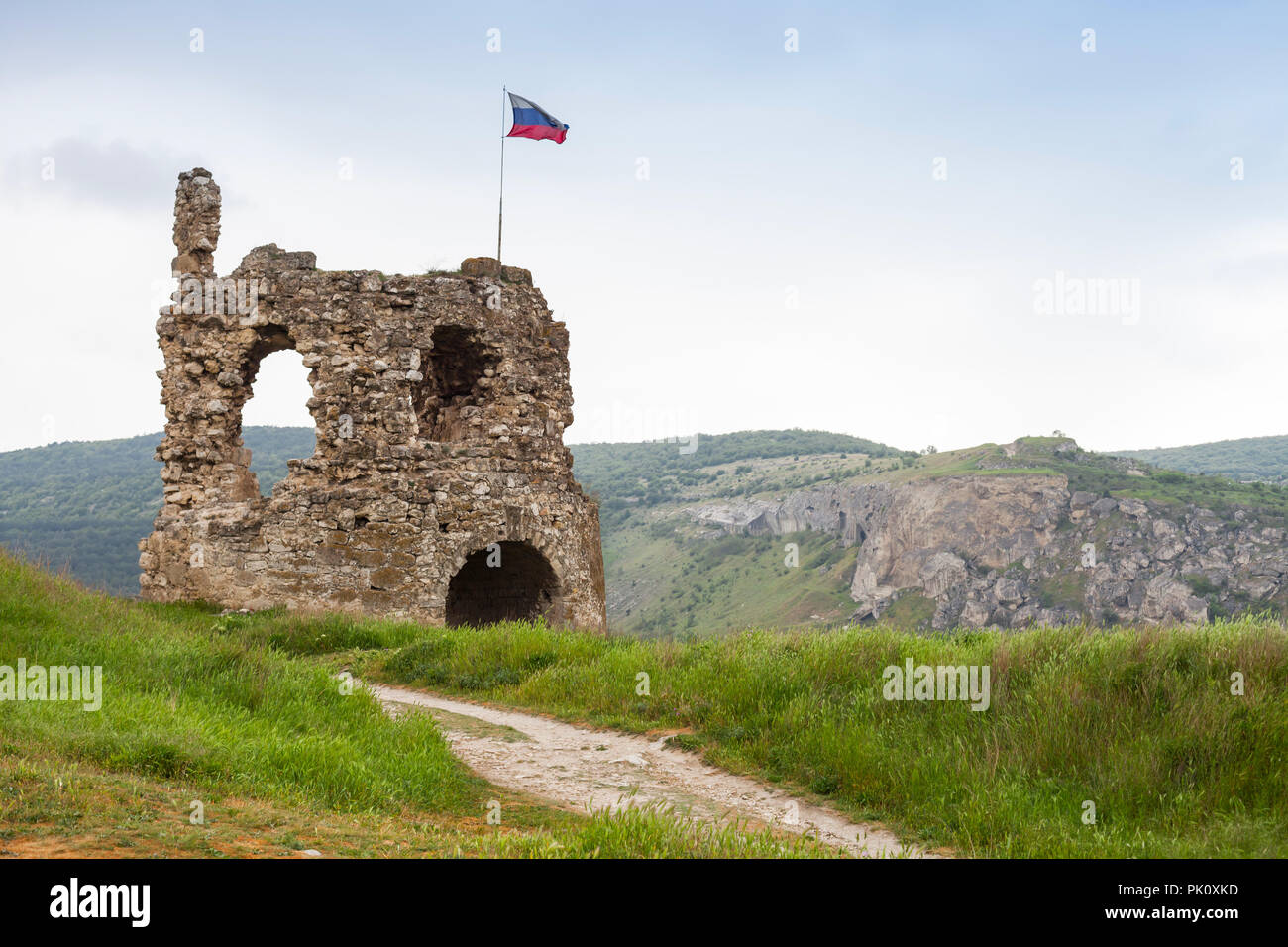 Russian flag mounted on ruins of ancient fortress Calamita in Inkerman, Crimea Stock Photo