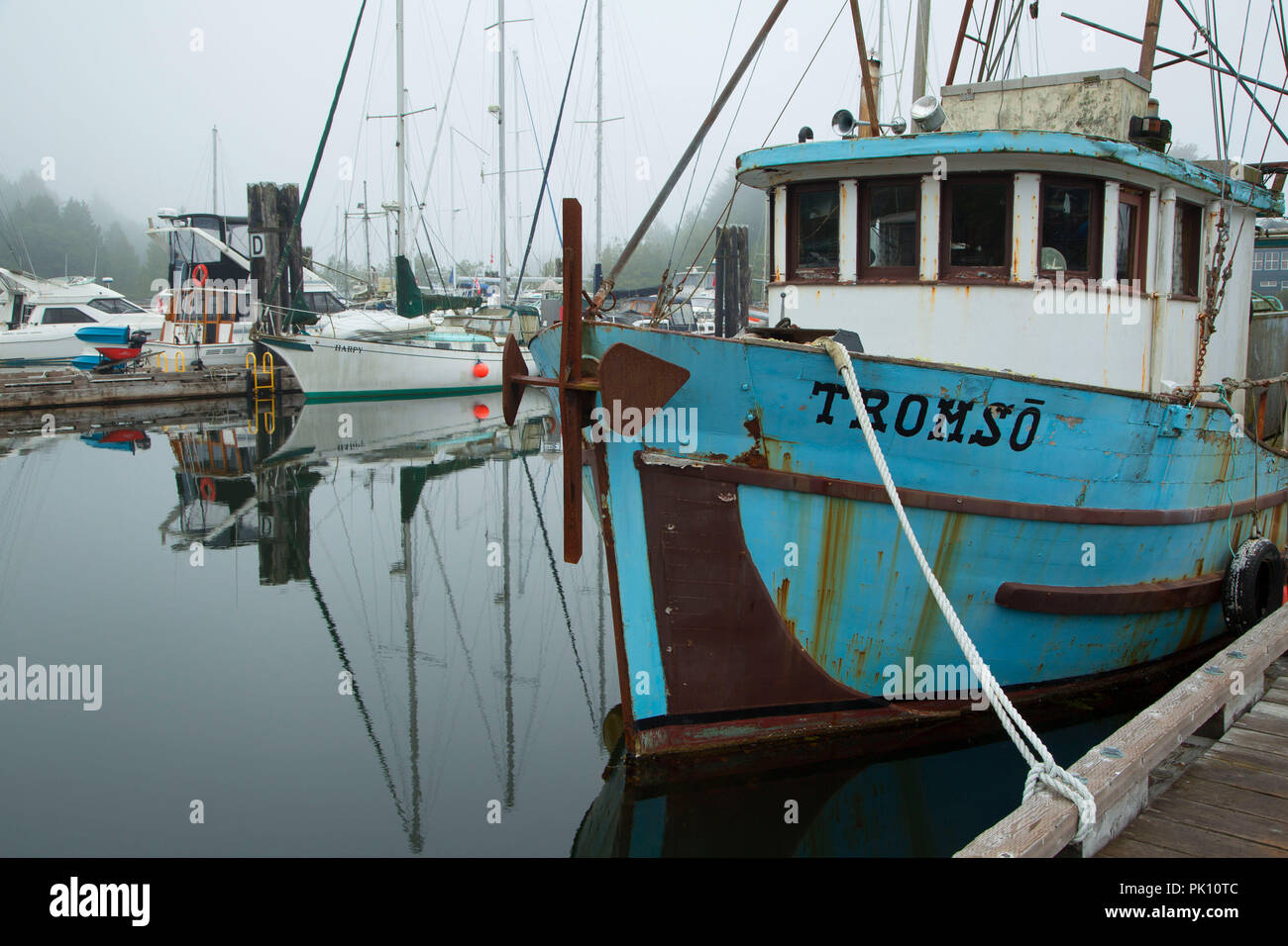 Boats in fog, Ucluelet Harbour, Ucluelet, British Columbia, Canada Stock Photo