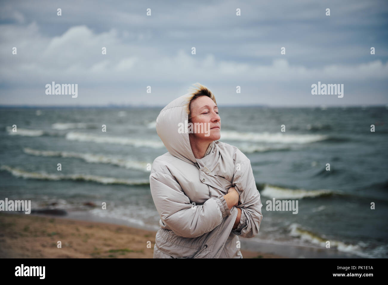Woman windy jacket hi-res stock photography and images - Alamy