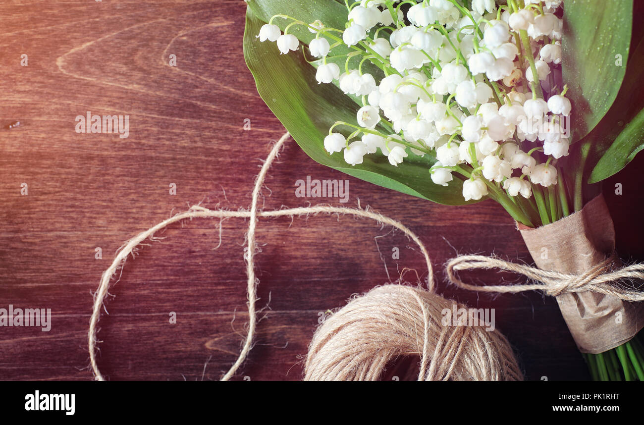 Bouquet of lilies of the valley on a table Stock Photo - Alamy
