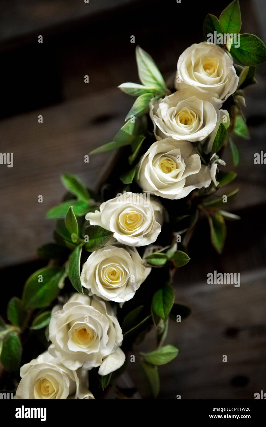 Close up of a bunch of yellow roses on a table Stock Photo