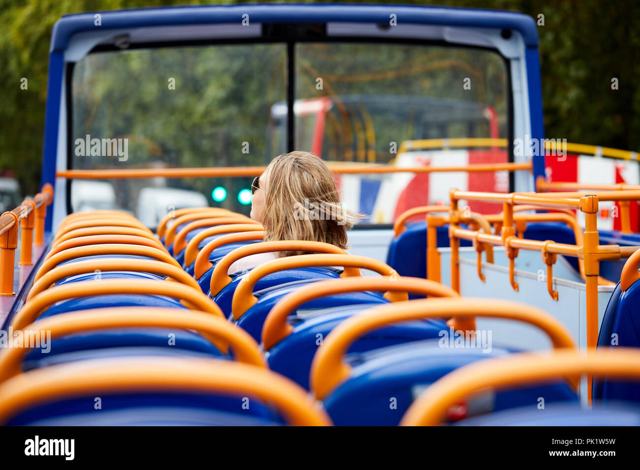 A sightseer on a London tourist bus . Stock Photo