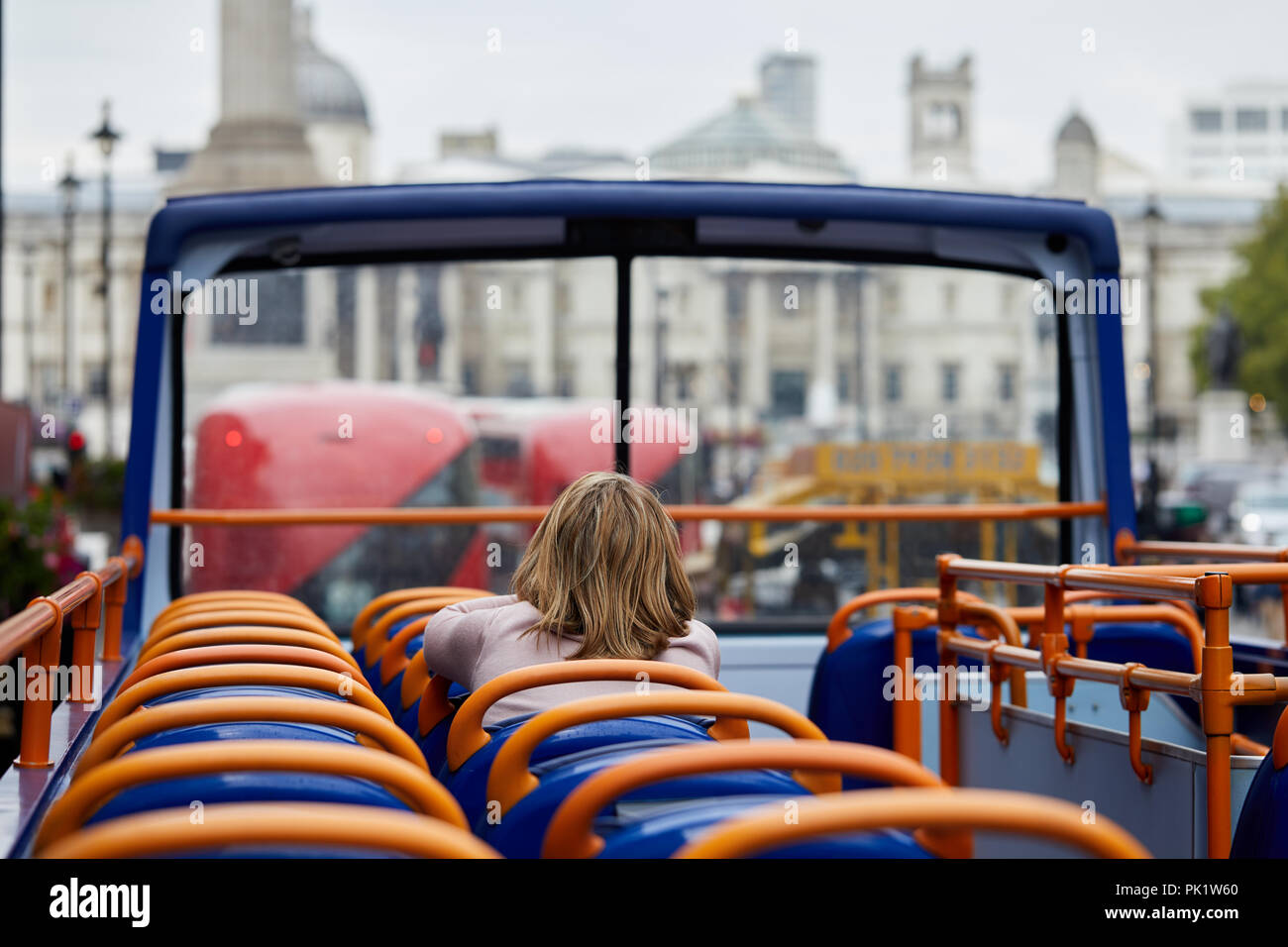 A sightseer on a London tourist bus . Stock Photo