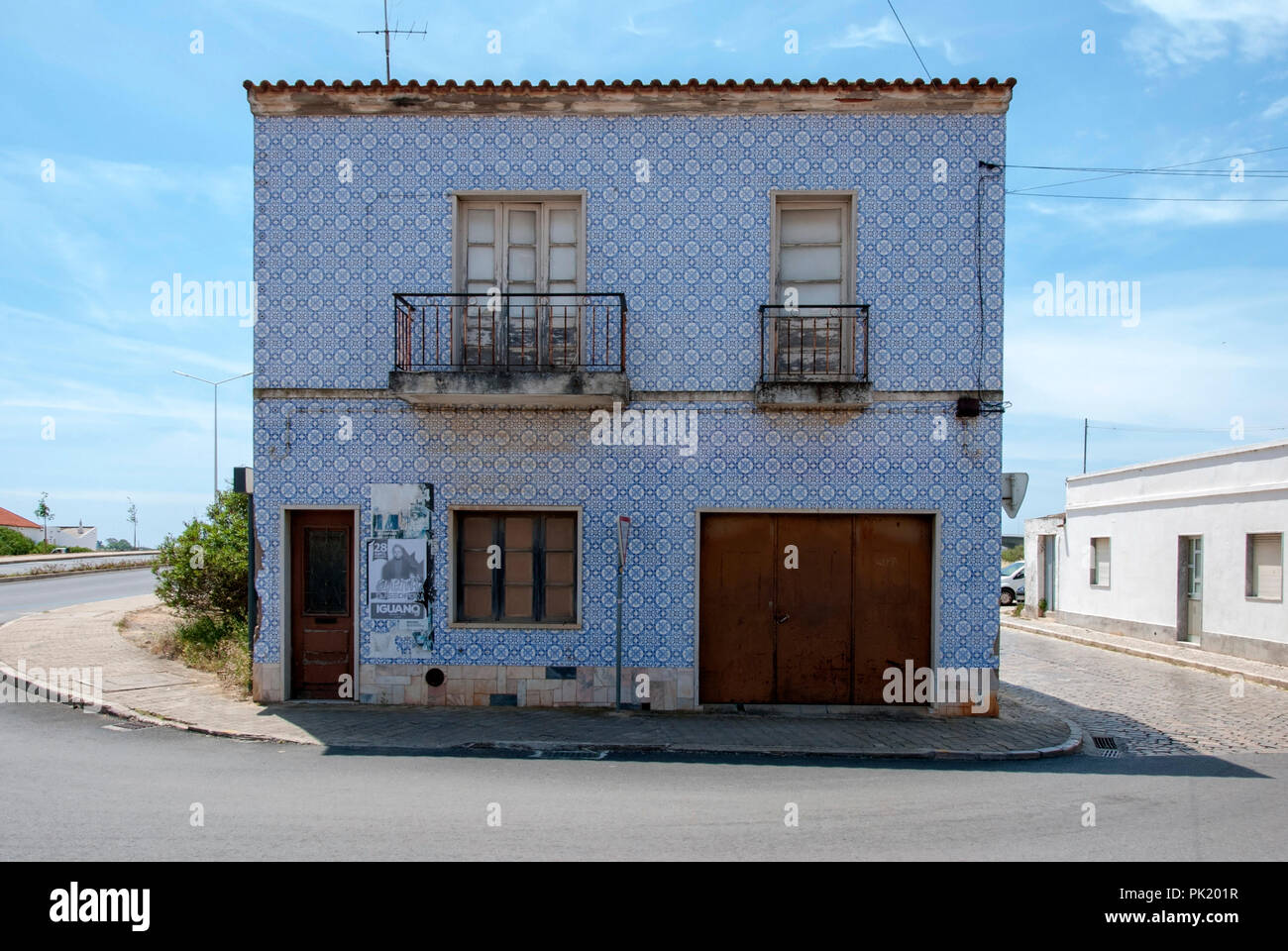 Traditional Portuguese Tiled Facade Dwelling House Tavira Portugal exterior view of traditional typical single solitary portuguese house home building Stock Photo