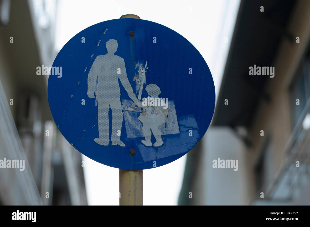 Round road sign 'Caution children' in the evening time in Greece Stock Photo
