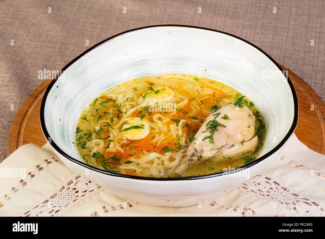 Chicken soup with leg and noodle Stock Photo - Alamy