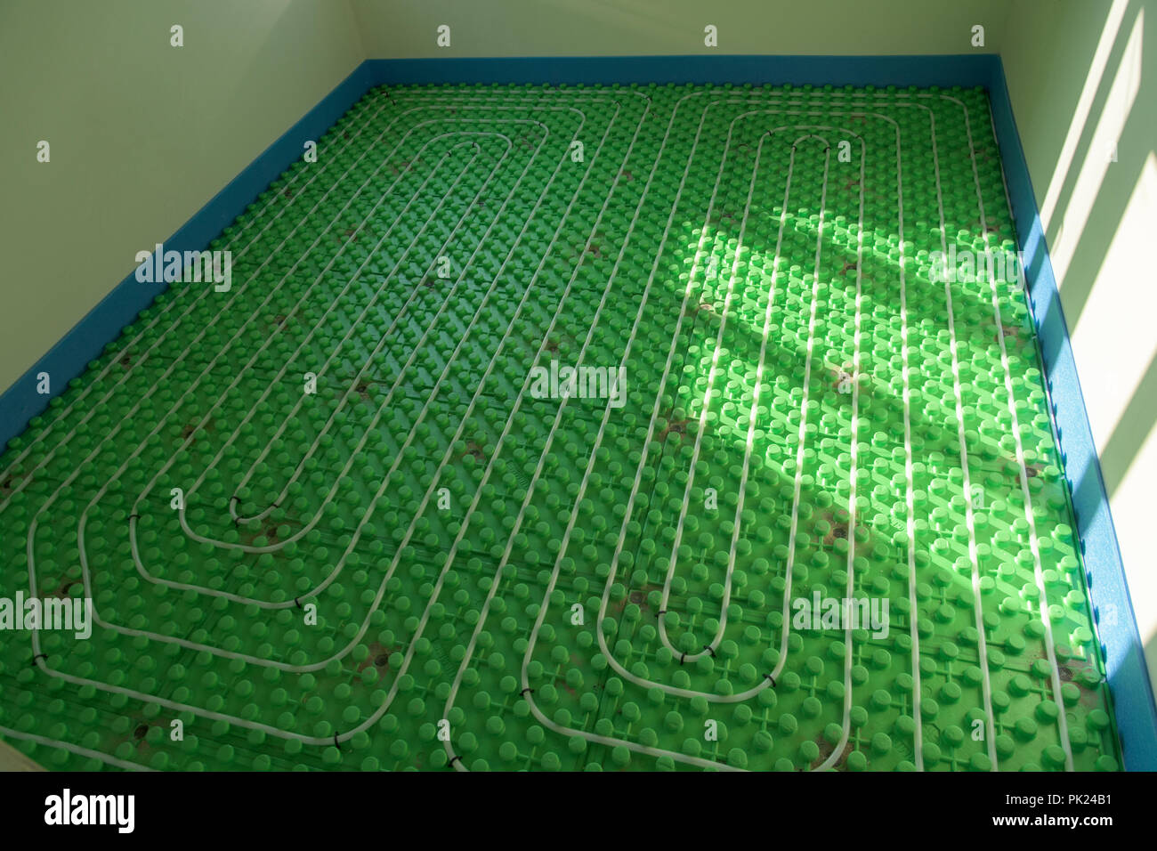 The floor heating system green home installation Stock Photo Alamy