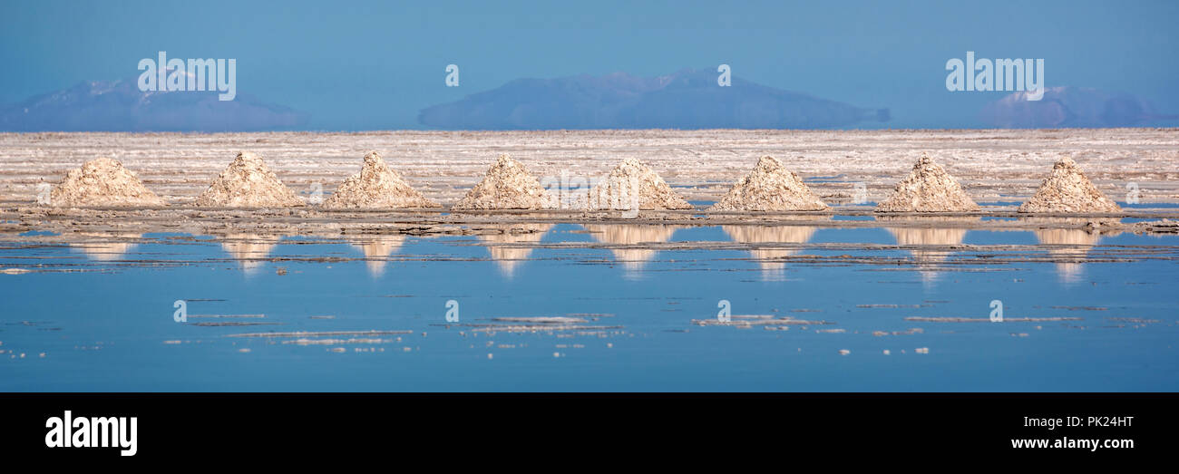 Panorama of piles of salt aligned in Salar de Uyuni (Uyuni salt flats), Potosi, Bolivia Stock Photo