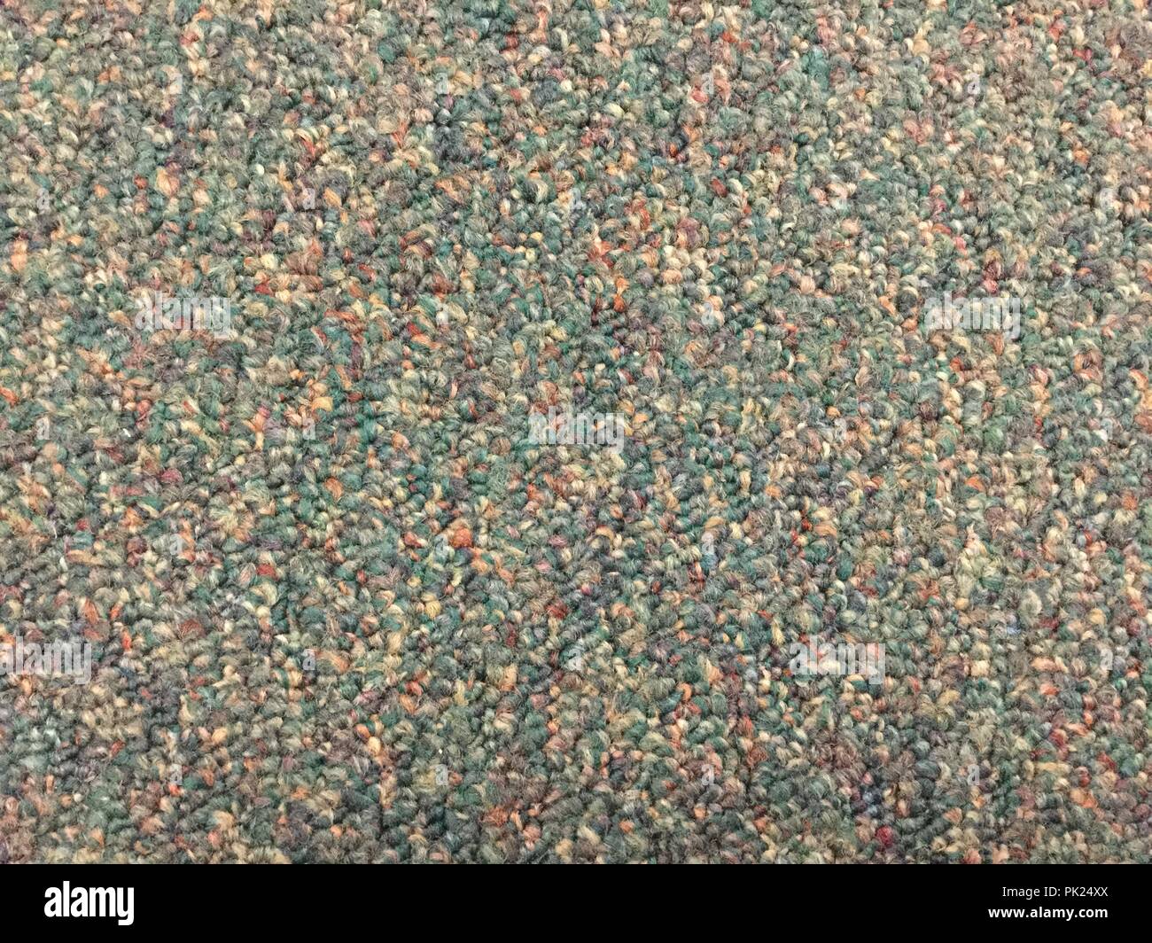 High traffic interior blue carpet floor covering. Stock Photo