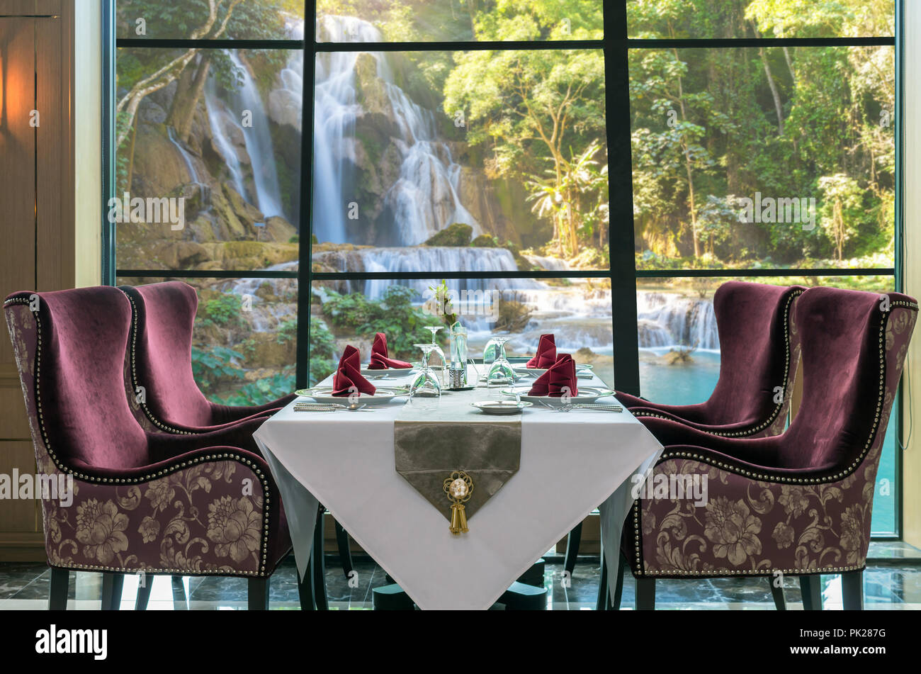 Luxury restaurant set over windows glass of the view of Beautiful waterfall in the forest, dicut each elements Stock Photo