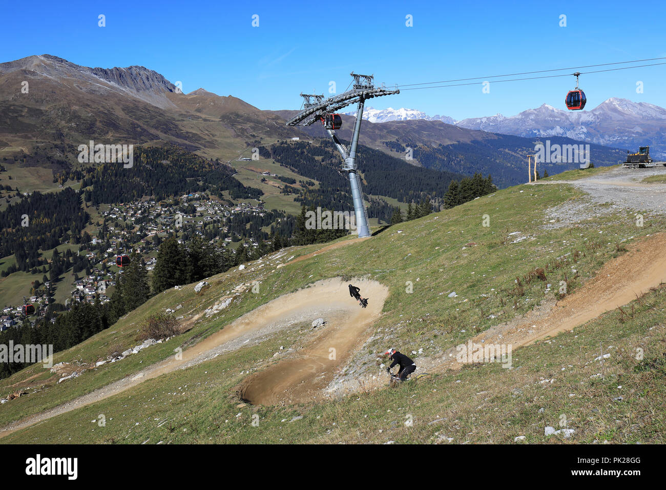 Downhill bike track and aerial passenger line to Scharmoin in the swiss alps, Lenzerheide, Switzerland Stock Photo