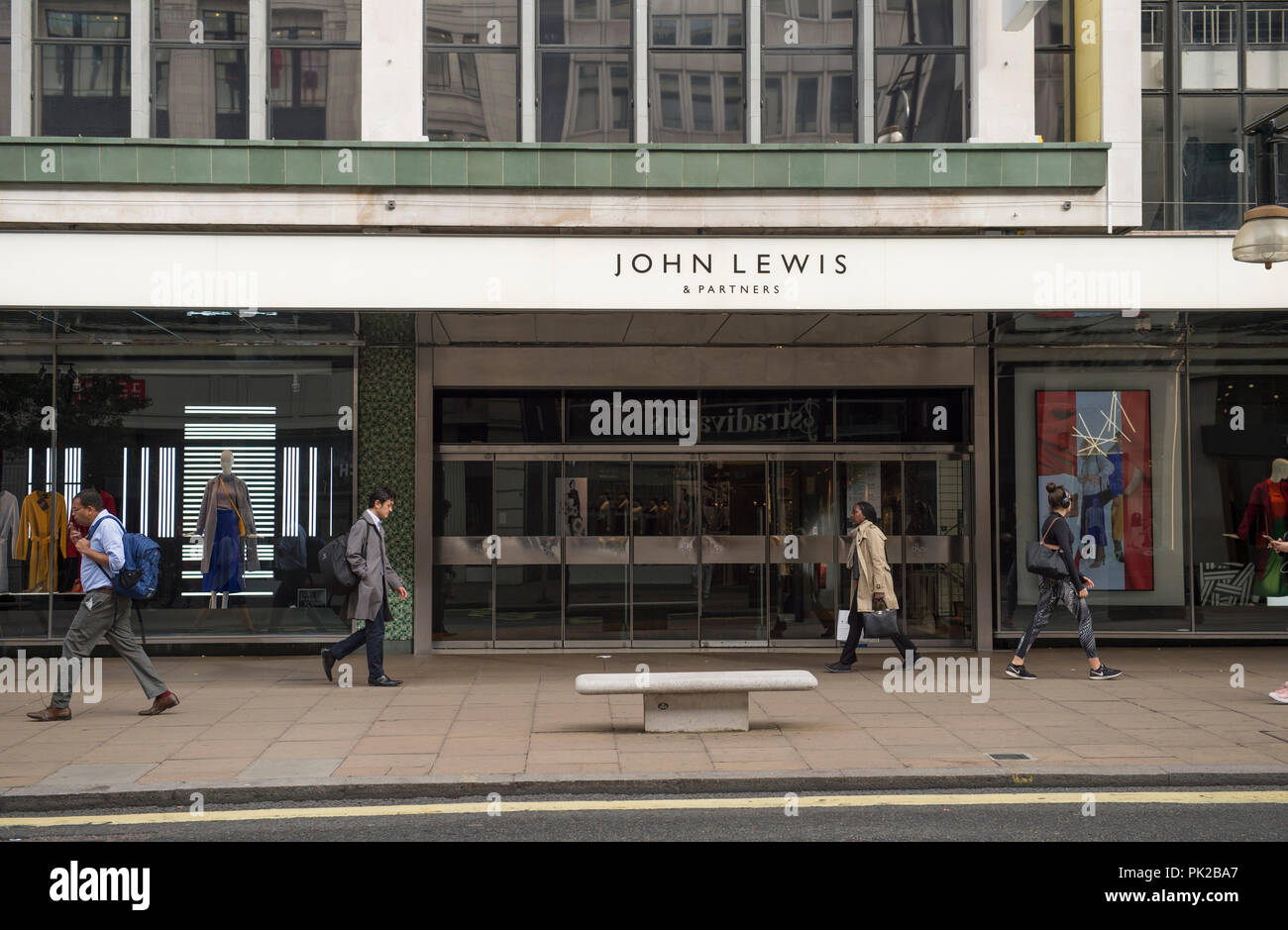 Oxford Street, London, UK. 10 September, 2018. John Lewis partnership rebrands itself John Lewis and Partners with new fascia signs appearing on the flagship Oxford Street store in central London on a quiet September weekday morning. The revised brand identity was designed by Pentagram. Credit: Malcolm Park/Alamy Live News. Stock Photo