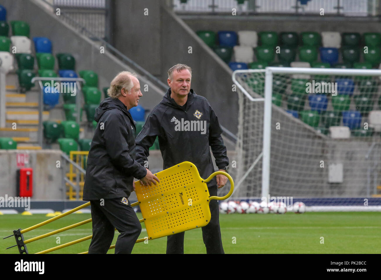Windsor Park, Belfast, Northern Ireland. 10 September 2018. After Saturday's defeat in the UEFA Nations League, Northern Ireland returned to training this morning at Windsor Park. Tomorrow night they play Israel in a friendly international. Northern ireland manager Michael O'Neill (left) with assistant Jimmy Nicholl. Credit: David Hunter/Alamy Live News. Stock Photo