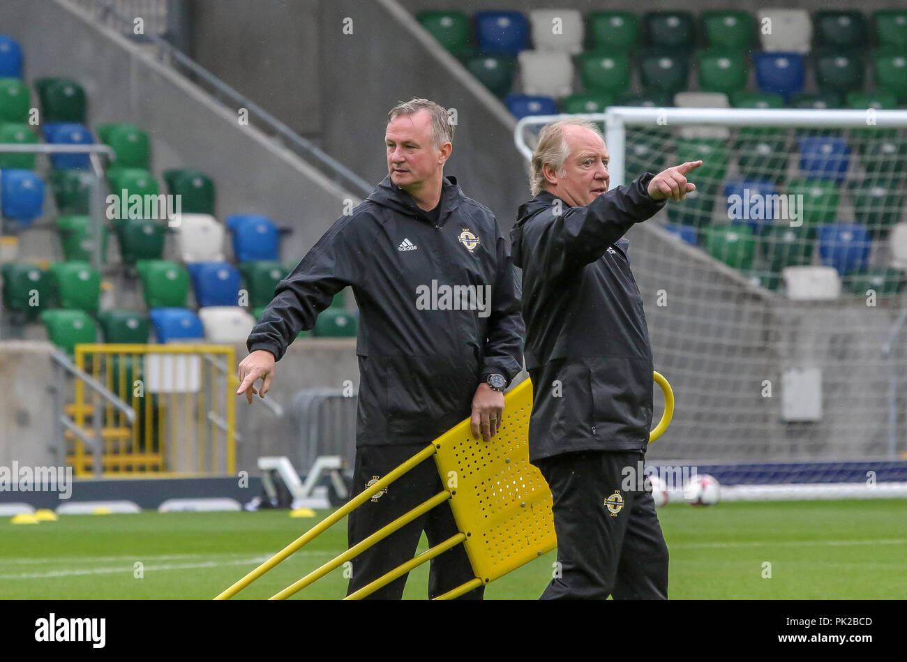 Windsor Park, Belfast, Northern Ireland. 10 September 2018. After Saturday's defeat in the UEFA Nations League, Northern Ireland returned to training this morning at Windsor Park. Tomorrow night they play Israel in a friendly international. Northern ireland manager Michael O'Neill (left) with assistant Jimmy Nicholl. Credit: David Hunter/Alamy Live News. Stock Photo