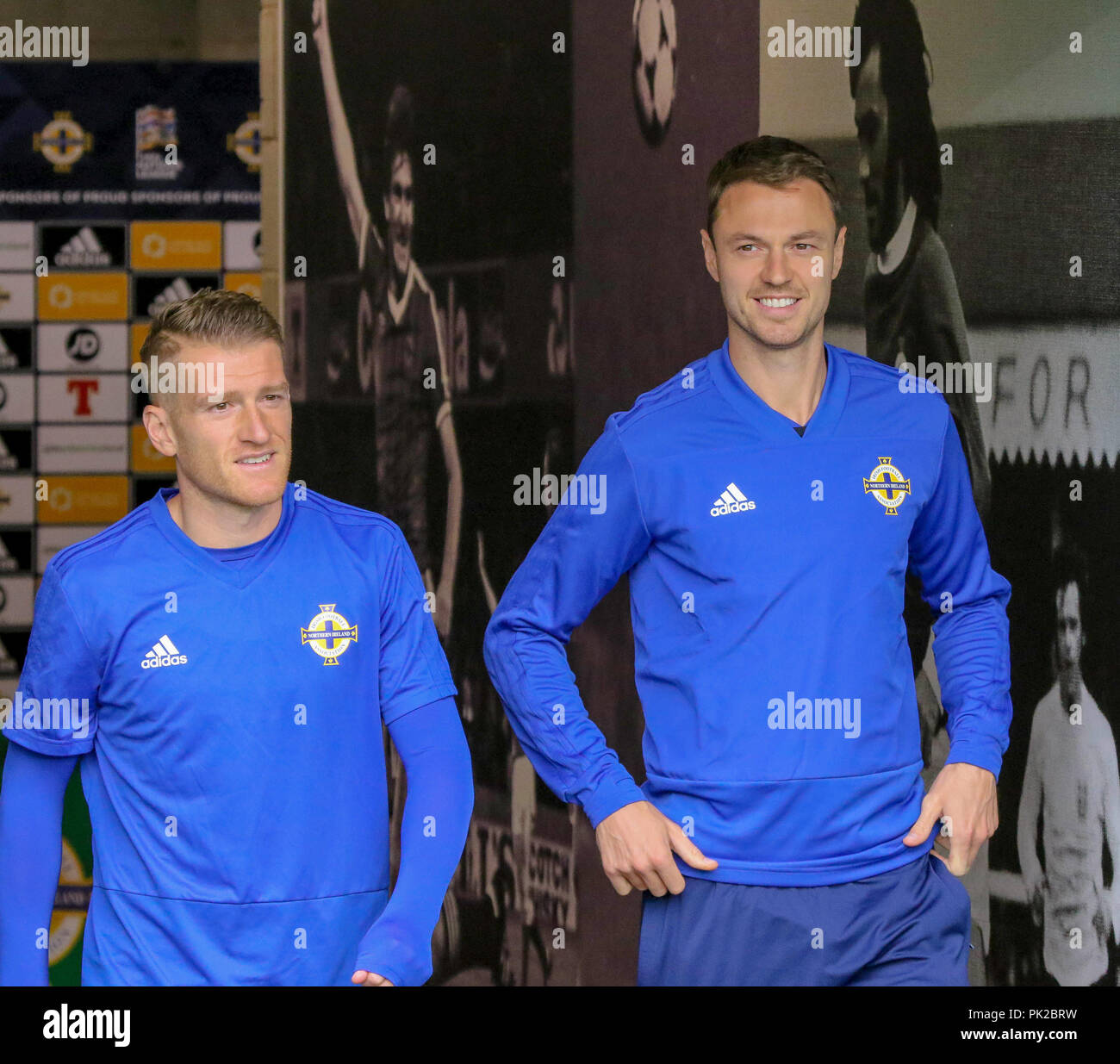 Windsor Park, Belfast, Northern Ireland. 10 September 2018. After Saturday's defeat in the UEFA Nations League, Northern Ireland returned to training this morning at Windsor Park. Tomorrow night they play Israel in a friendly international. Steven Davis (left) and Jonny Evans. Credit: David Hunter/Alamy Live News. Stock Photo