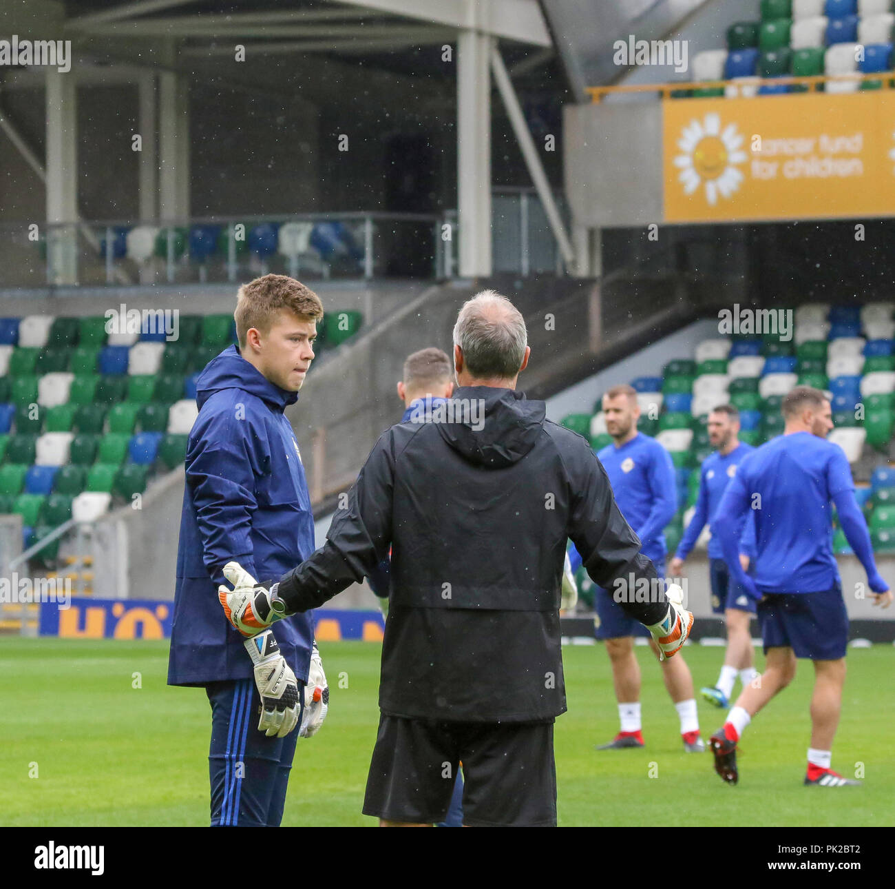 Windsor Park, Belfast, Northern Ireland. 10 September 2018. After Saturday's defeat in the UEFA Nations League, Northern Ireland returned to training this morning at Windsor Park. Tomorrow night they play Israel in a friendly international. Goalkeeper Bailey Peacock-Farrell (l) talks to goal-keeping coach Maik Taylor. Credit: David Hunter/Alamy Live News. Stock Photo