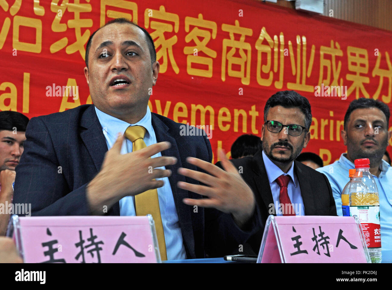 (180910) -- YIWU, Sept. 10, 2018 (Xinhua) -- Ammar gives a lecture on how to seize business opportunities in Yiwu, east China's Zhejiang Province, Sept. 8, 2018. Ammar Al- baadani, a 40-year-old Yemeni, is now a Yiwu resident, working as a doctor in Yiwu of China's Zhejiang Province. He came to China in the year of 1996 as a student and finished his bachelor's, master's degree in Tianjin Medical University and doctor's degree in Zhejiang University in China. Later he started his own business in Yiwu, and set up a non-profit organization 'Silu (Silk Road in Chinese) Culture Club' to pr Stock Photo