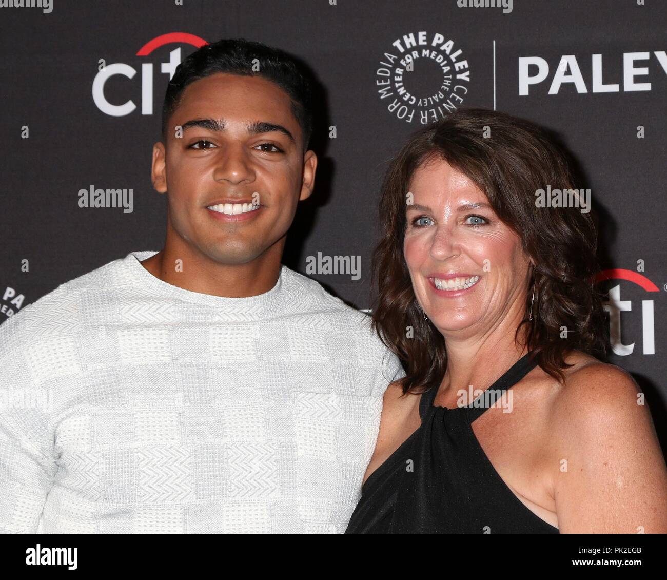 Beverly Hills, CA. 8th Sep, 2018. Michael Evans Behling, Carol Behling at arrivals for The CW Presents ALL AMERICAN and CHARMED at the 12th Annual PaleyFest Fall TV Previews, Paley Center for Media, Beverly Hills, CA September 8, 2018. Credit: Priscilla Grant/Everett Collection/Alamy Live News Stock Photo