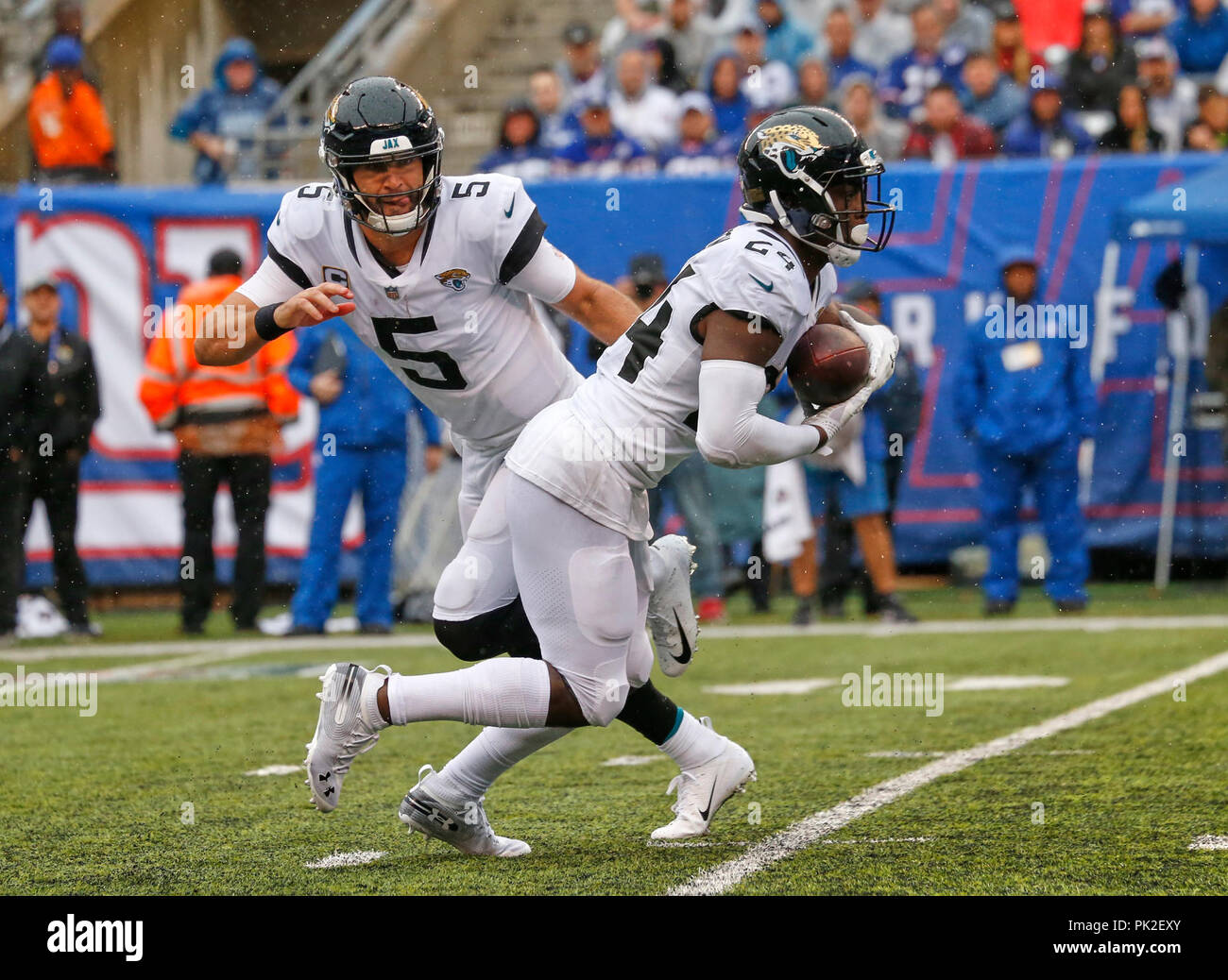 September 9, 2018 - East Rutherford, New Jersey, U.S. - Jacksonville Jaguars quarterback Blake Bortles (5) hands off to running back T.J. Yeldon (24) during a NFL game between the Jacksonville Jaguars and the New York Giants at MetLife Stadium in East Rutherford, New Jersey. The Jaguars defeated the Giants 20-15. Duncan Williams/CSM Stock Photo