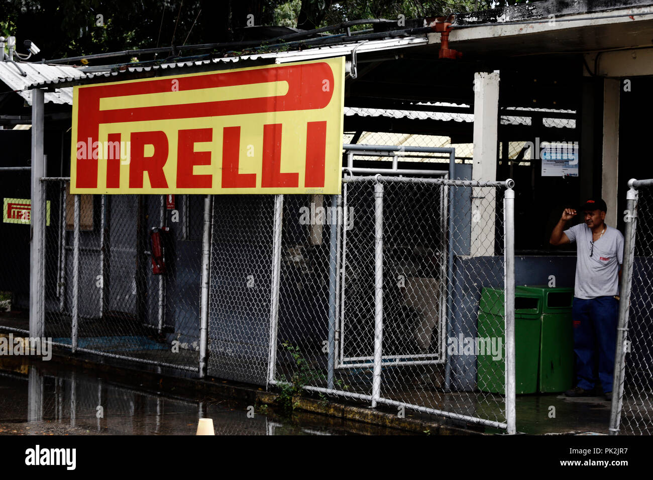 Guacara, Carabobo, Venezuela. 10th Sep, 2018. September 10, 2018. A worker waits at the entrance of the Pirelli tire factory. On Friday, the company was informed about the sale of the company to a South American consortium and that within the sale was the clause the acquisition of human resources. In Guacara, Carabobo state. Venezuela. Photo: Juan Carlos Hernandez Credit: Juan Carlos Hernandez/ZUMA Wire/Alamy Live News Stock Photo