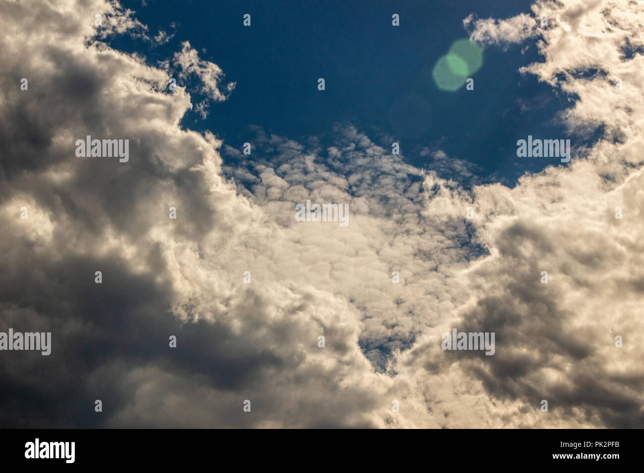 Clouds against the blue sky Stock Photo