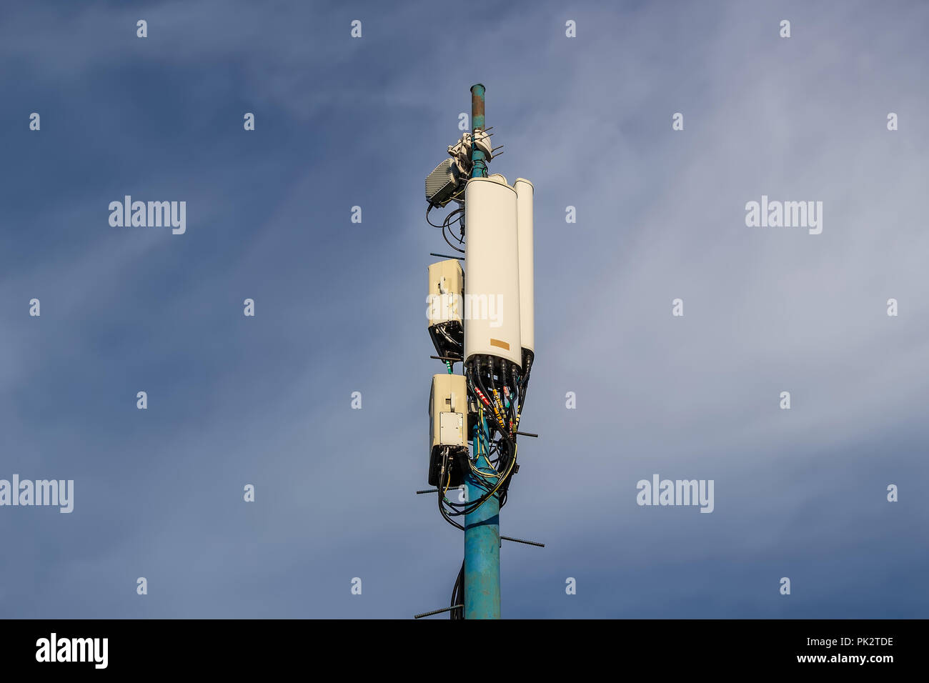 Cellular antenna on blue sky background Stock Photo - Alamy