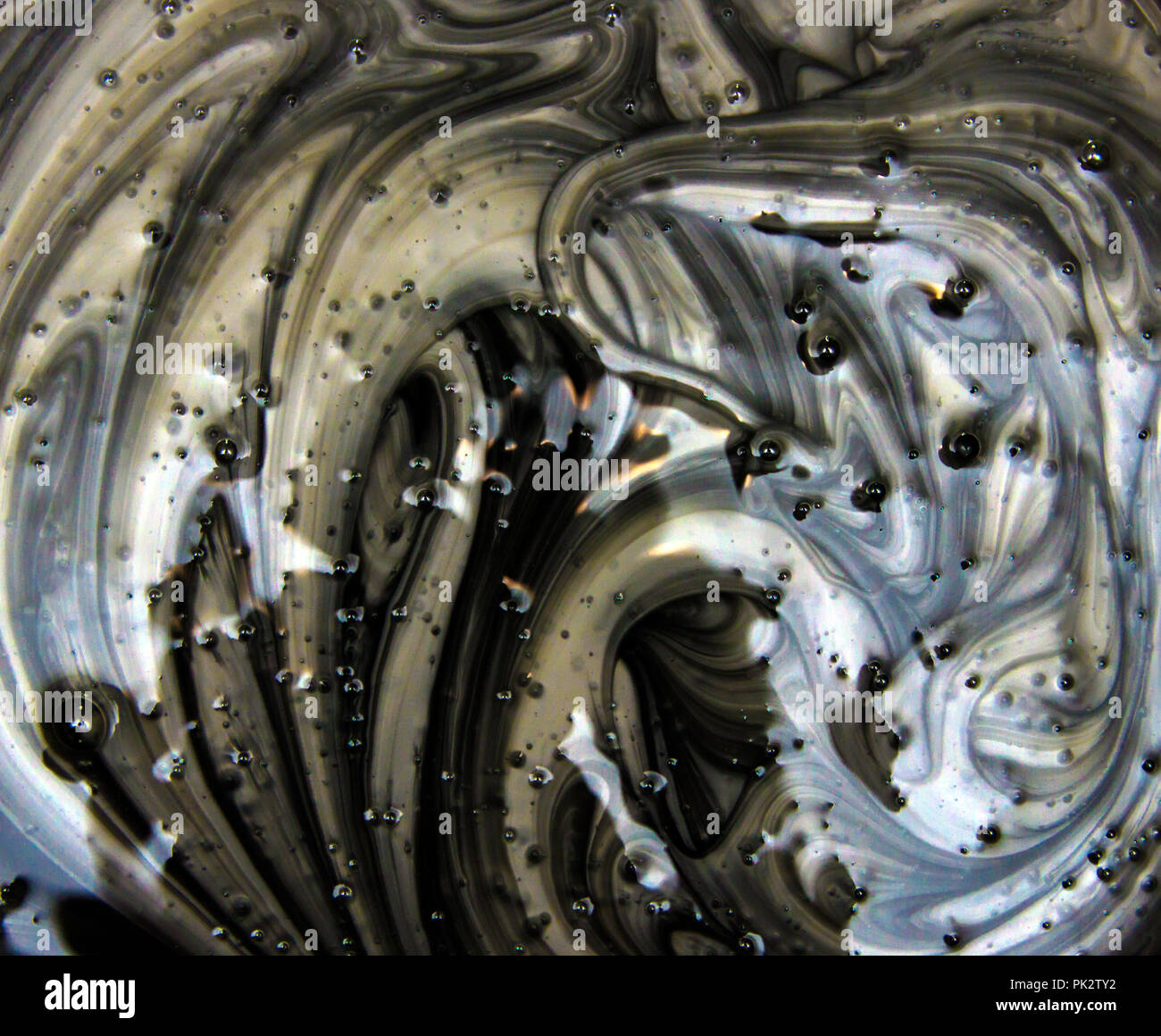 Mix of a silver and black paint, closeup Stock Photo Alamy