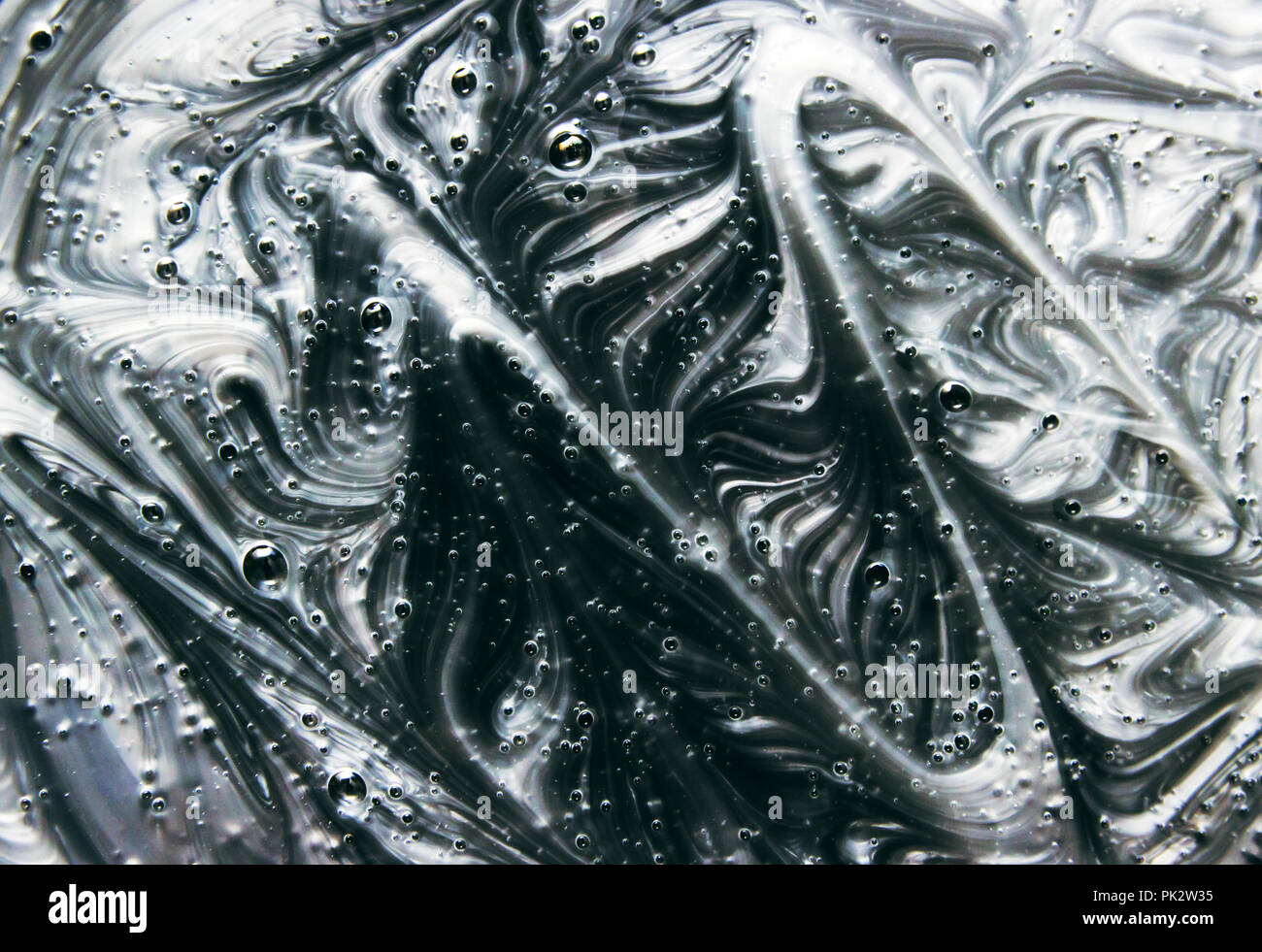 Mix of a silver and black paint, closeup Stock Photo Alamy